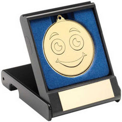 BLACK PLASTIC BOX WITH 50mm GOLD SMILEY FACE MEDAL TROPHY - 3.5in